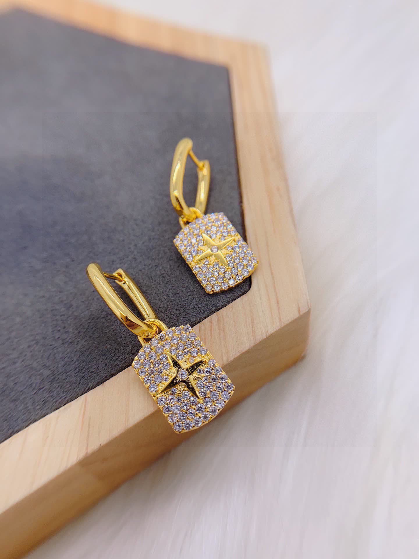 APM Monaco Elegant Gold and Diamond Star Earrings